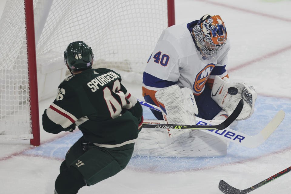 New York Islanders' goalie Semyon Varlamov (40) stops a shot by Minnesota Wild's Jared Spurgeon (46) during the first period of an NHL hockey game Sunday, Nov. 7, 2021, in St. Paul, Minn. (AP Photo/Stacy Bengs)
