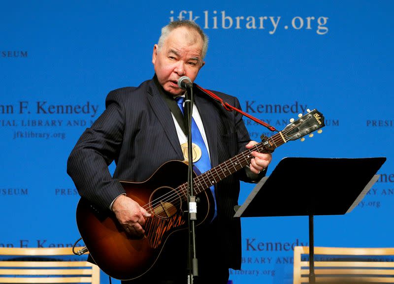 FILE PHOTO: Musician John Prine performs after accepting his PEN New England Song Lyrics of Literary Excellence Award during a ceremony at the John F. Kennedy Library in Boston