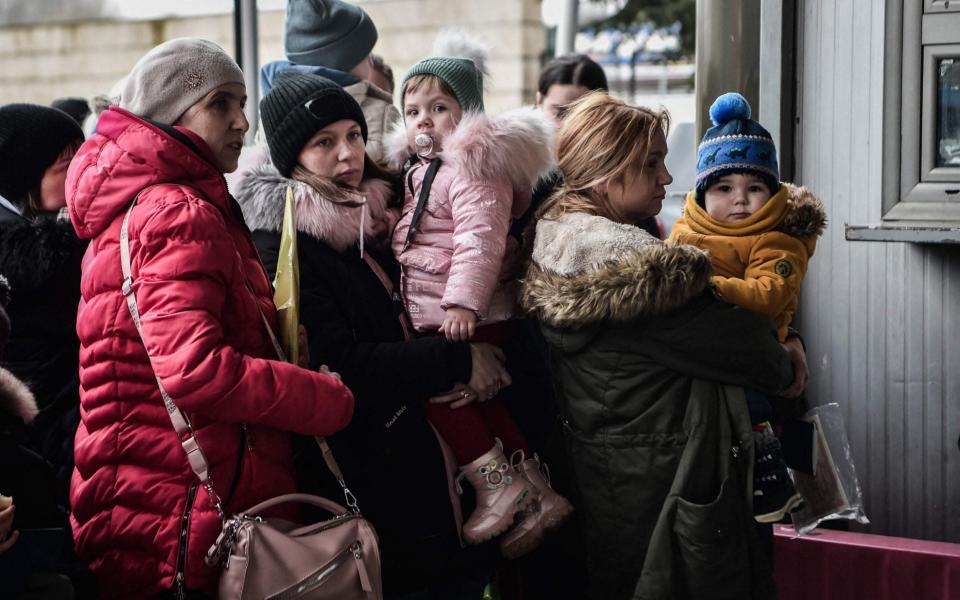 Ukrainian refugees arrive by bus in northern Greece on 7 March 2022. - Sakis Mitrolidis/AFP