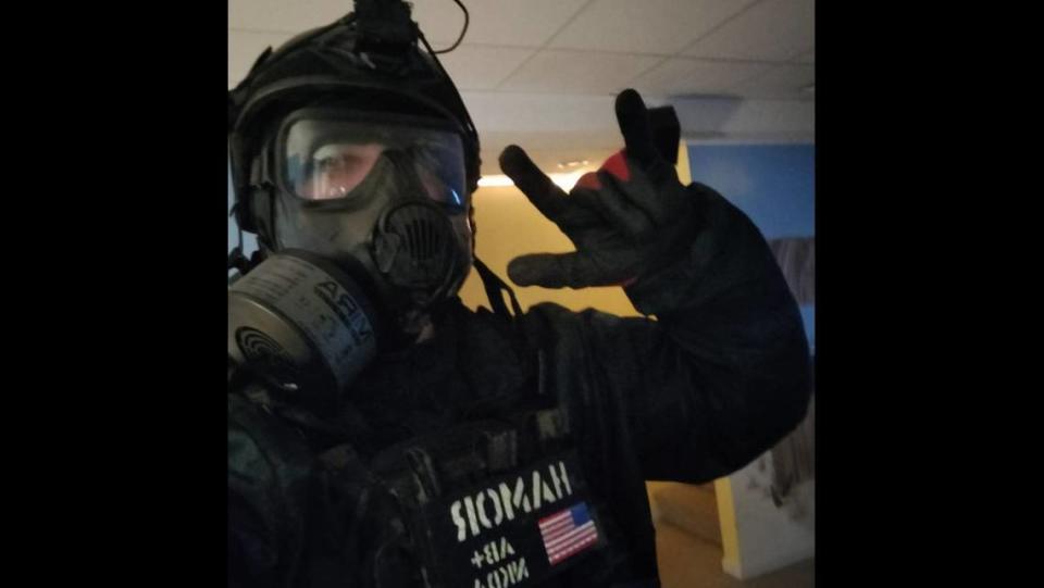 Bailey Hamor posted a photo of him wearing a gas mask and other combat gear on his Facebook page in 2022. A month later, he was dressed this way when police arrested him for murder. Provided