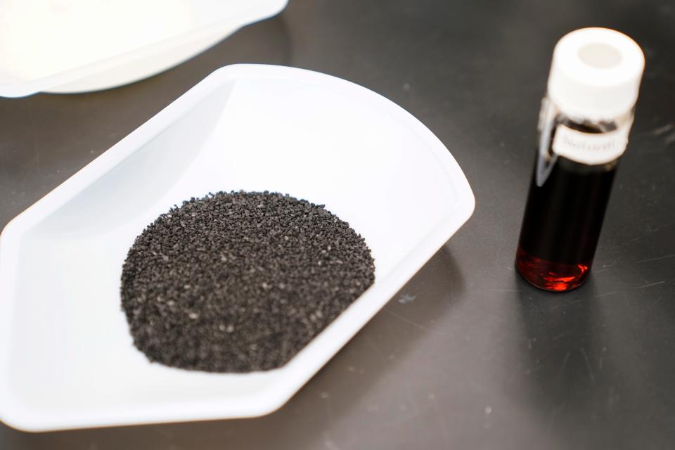 A sample of granular activated carbon, used to remove PFAS from water, sits on display during a tour of the U.S. Environmental Protection Agency Center For Environmental Solutions and Emergency Response in 2023.