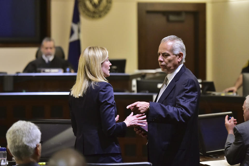 Prosecutor Tamara Strauch, left, speaks with defense attorney Raymond Fuchs during the capital murder trial of Otis McKane in the 2016 shooting death of San Antonio Police Detective Benjamin Marconi, Monday, July 26, 2021, in San Antonio. Jurors deliberated about 25 minutes Monday before convicting McKane. (Robin Jerstad/The San Antonio Express-News via AP)