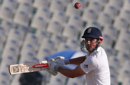 Cricket - India v England - Third Test cricket match - Punjab Cricket Association Stadium, Mohali, India - 26/11/16. England's Alastair Cook plays a shot. REUTERS/Adnan Abidi