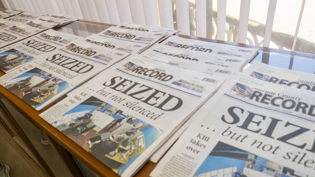 Copies of a newspaper on a table