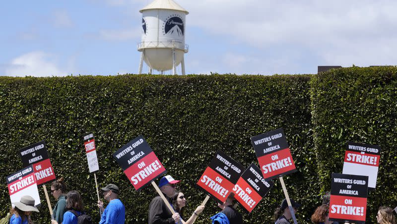Striking writers take part in a rally in front of Paramount Pictures studio, Tuesday, May 2, 2023, in Los Angeles. A tentative deal was reached, Sunday, Sept. 24, 2023, to end Hollywood’s writers strike after nearly five months.