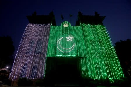 A general view of the Metropolitan building illuminated with national flag, ahead of Pakistan's Independence Day in Lahore