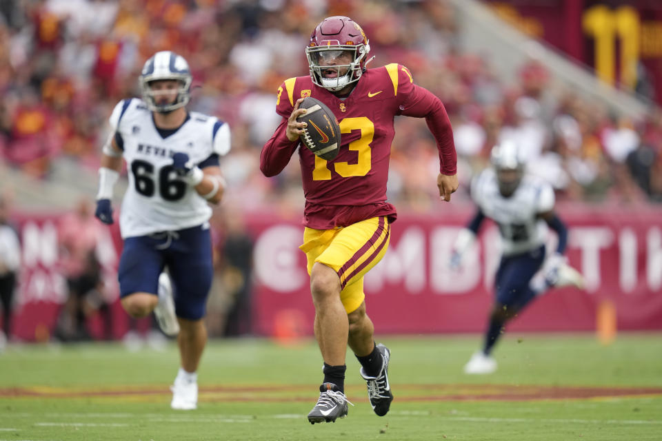 Southern California quarterback Caleb Williams (13) runs the ball during the first half of an NCAA college football game against Nevada in Los Angeles, Saturday, Sept. 2, 2023. (AP Photo/Ashley Landis)