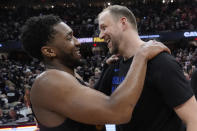 Cleveland Cavaliers' Donovan Mitchell, left, and Orlando Magic's Joe Ingles, right, talk after they defeated the Orlando Magic in Game 7 of an NBA basketball first-round playoff series Sunday, May 5, 2024, in Cleveland. (AP Photo/Sue Ogrocki)