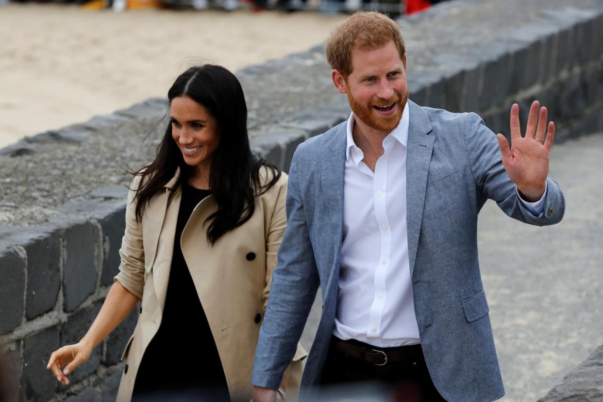 Prince Harry and Meghan Markle greet well-wishers on the beach in Melbourne: REUTERS