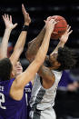 Chicago State forward Aaris-Monte Bonds, right, shoots against Northwestern forward Robbie Beran and forward Pete Nance during the first half of an NCAA college basketball game in Evanston, Ill., Saturday, Dec. 5, 2020. (AP Photo/Nam Y. Huh)