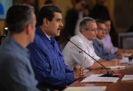 Venezuela's President Nicolas Maduro (2nd L) speaks during a meeting with ministers in Caracas, Venezuela January 11, 2018. Miraflores Palace/Handout via REUTERS