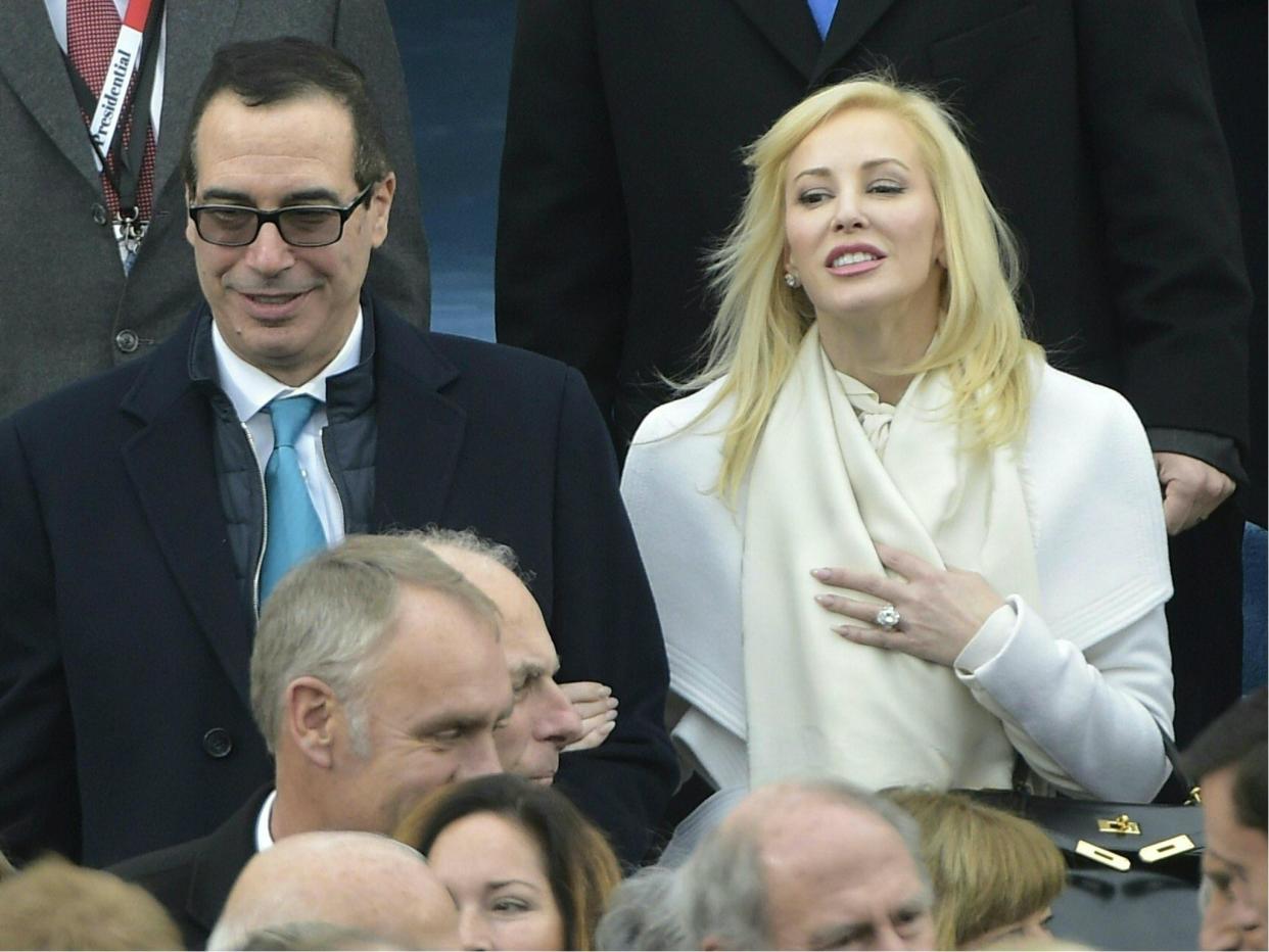 Donald Trump's Treasury Secretary Steve Mnuchin is being investigated by his own agency for possibly using taxpayer to take his wife Louise Linton to watch the solar eclipse: MANDEL NGAN/AFP/Getty Images