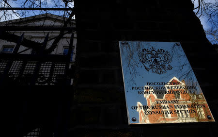 A sign with a coat of arms is seen on the wall of the consular section of Russia's embassy in London, Britain, March 16, 2018. REUTERS/Toby Melville