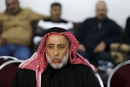 Suleiman Al Saad, the uncle of Anwar Abu Zeid, the Jordanian officer whom the government said killed five people at a training facility, speaks to the media at their family Diwan (Family Gathering Place) in Raymun village in the city of Jerash, north of Amman, Jordan, November 9, 2015. REUTERS/Muhammad Hamed