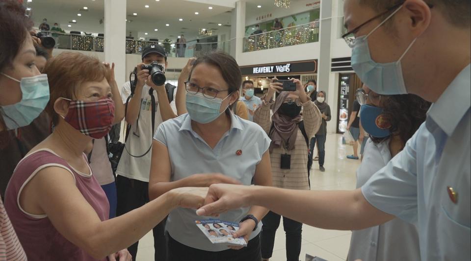 Workers' Party Sylvia Lim (centre) and the WP candidates for Sengkang GRC speak to residents at Rivervale Plaza on Tuesday, 7 July 2020. PHOTO: Nick Tan/Yahoo News Singapore 