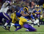 September 27, 2018; Los Angeles, CA, USA; Minnesota Vikings wide receiver Stefon Diggs (14) is brought down by Los Angeles Rams linebacker Dominique Easley (91) and defensive tackle Ndamukong Suh (93) during the first half at the Los Angeles Memorial Coliseum. Mandatory Credit: Gary A. Vasquez-USA TODAY Sports