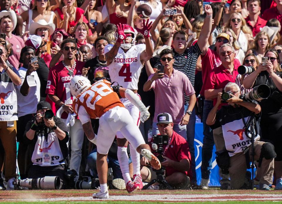 Oklahoma wide receiver Nic Anderson catches the game-winning touchdown in the final seconds of Saturday's 34-30 win over Texas at the Cotton Bowl. The score wiped out what Texas thought was Bert Auburn's winning 45-yard field goal with 77 seconds left to play.