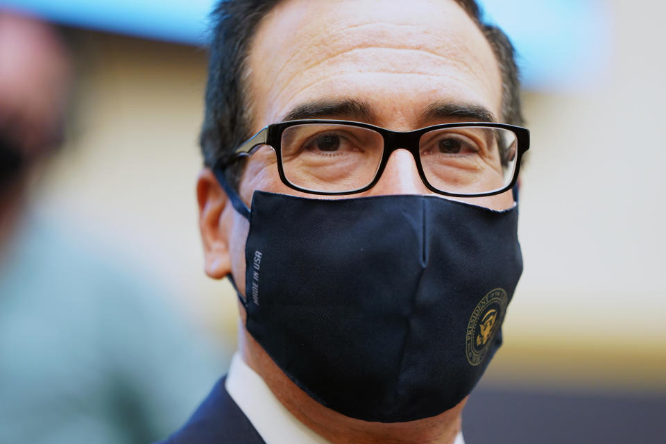 Treasury Secretary Steven Mnuchin wears a face mask as he arrives for a House Financial Services Committee hearing about the government’s emergency aid to the economy in response to the coronavirus on Capitol Hill in Washington on Tuesday, Sept. 22, 2020. (Joshua Roberts/Pool via AP)
