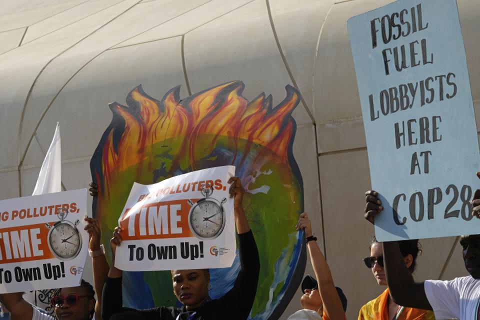 People participate in a demonstration against fossil fuels at the COP28 U.N. Climate Summit, Tuesday, Dec. 5, 2023, in Dubai, United Arab Emirates. (AP Photo/Peter Dejong)