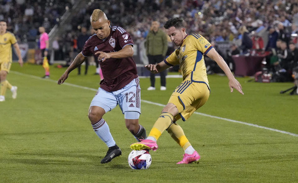 Colorado Rapids forward Michael Barrios, left, and Real Salt Lake defender Bryan Oviedo fight for control of the ball in the second half of an MLS soccer match Saturday, May 20, 2023, in Commerce City, Colo. (AP Photo/David Zalubowski)