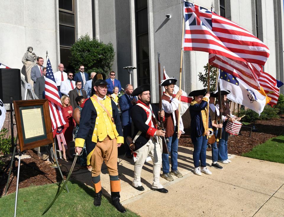 Members of the Tuscaloosa County Bar Association gather and read the Declaration of Independence on the Tuscaloosa County Courthouse steps July 2, 2024 as a part of the nation’s Independence Day celebration. The honor guard from the Sons of the American Revolution Black Warrior Chapter present the colors.