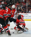 NEWARK, NJ - APRIL 19: Mark Fayne #29 and goaltender Martin Brodeur #30 of the New Jersey Devils combine to stop Stephen Weiss #9 of the Florida Panthers in Game Four of the Eastern Conference Quarterfinals during the 2012 NHL Stanley Cup Playoffs at Prudential Center on April 19, 2012 in Newark, New Jersey. (Photo by Bruce Bennett/Getty Images)