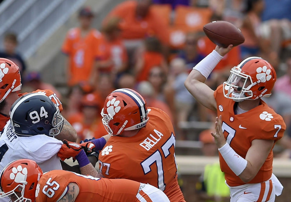 FILE - In this Sept. 15, 2018, file photo, Clemson quarterback Chase Brice delivers a pass as Zach Giella (77) blocks during the second half of an NCAA college football game in Clemson, S.C. Clemson tight end Braden Galloway and offensive lineman Zach Giella will miss next season after an NCAA panel rejected the school's appeal of their drug suspension. Clemson athletic spokesman Jeff Kallin said the school learned of the NCAA's decision on Wednesday, May 22, 2019. (AP Photo/Richard Shiro, File)