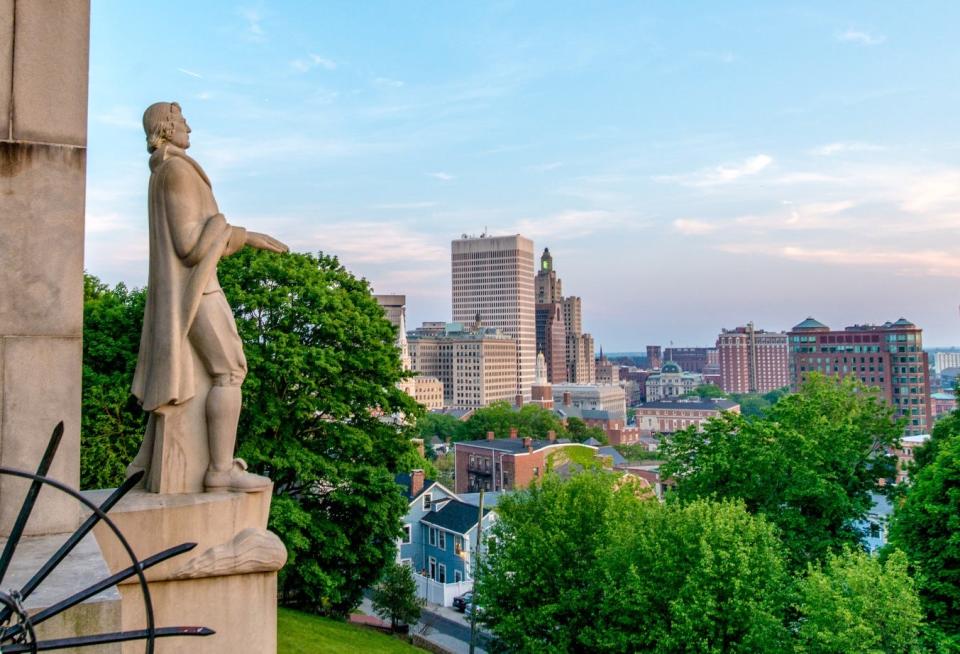 The city's statue of Roger Williams overlooks the Providence skyline from Prospect Terrace.  [Journal files]