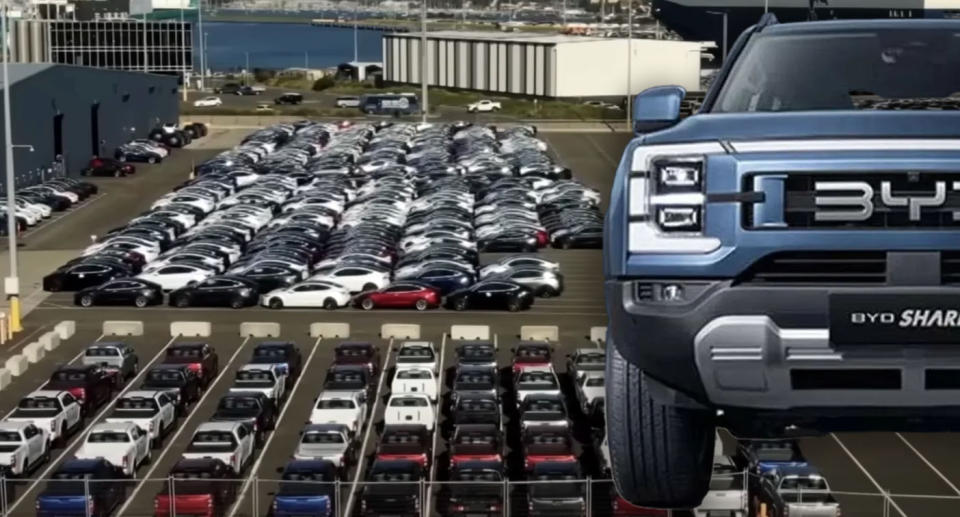 Teslas at a Melbourne dock next to Chinese EV brand BYD Shark