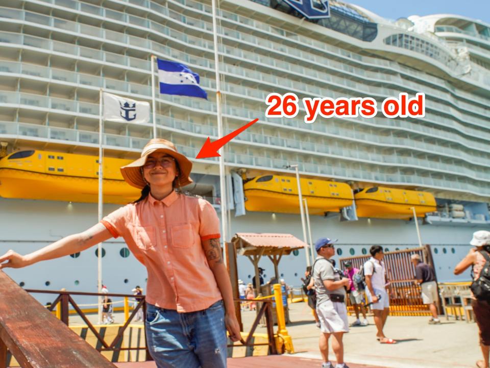 The author stands in front of the ship. An arrow that reads "26 years old" points to the author