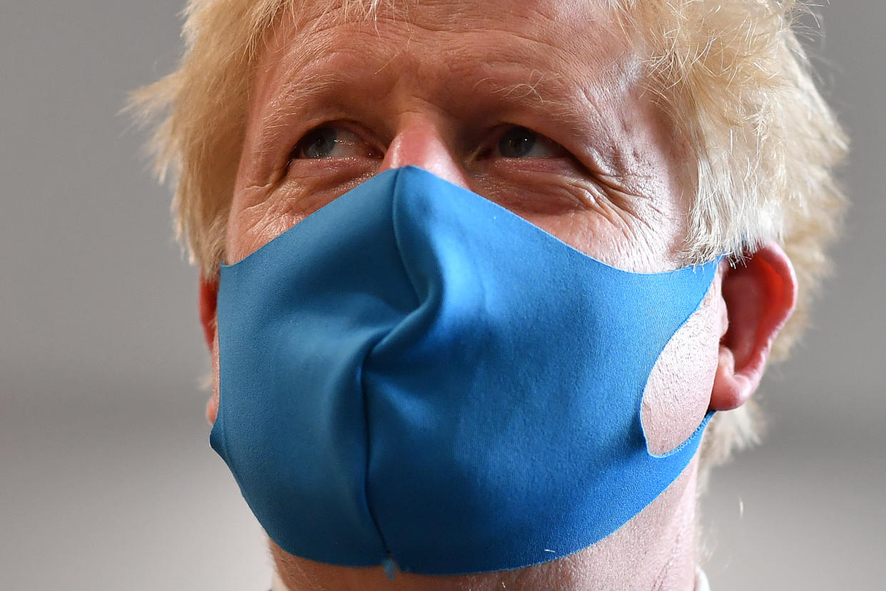 Prime Minister Boris Johnson, wearing a face mask, during a visit to the headquarters of the London Ambulance Service NHS Trust.