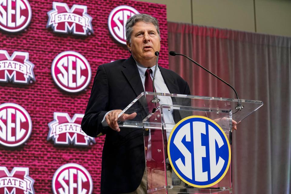 Mississippi State coach Mike Leach shown on the stage during SEC Media Days at the College Football Hall of Fame.