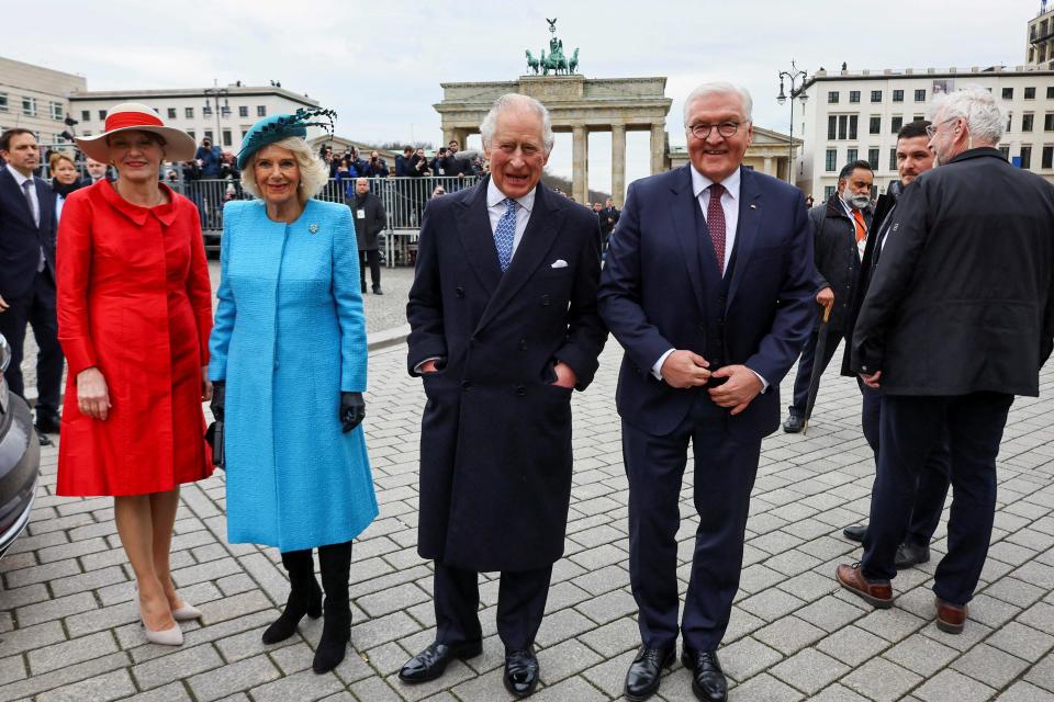Britain's King Charles III (2nd R) and Britain's Camilla (2nd L), Queen Consort, German President Frank-Walter Steinmeier (R) and his wife Elke Buedenbender pose during a welcome ceremony at Brandenburg Gate in Berli (POOL/AFP via Getty Images)