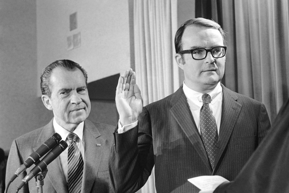 William D. Ruckelshaus is sworn in as administrator of the new Environmental Protection Agency with President Richard Nixon, left, on Dec. 4, 1970, at the White House ceremony in Washington.