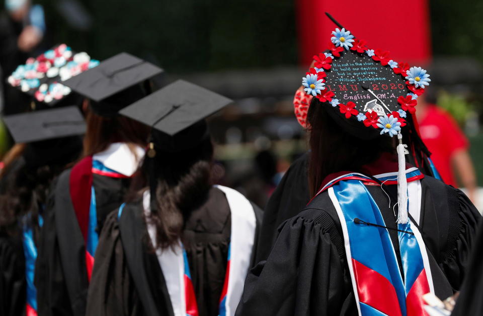 Graduates parade during Loyola Marymount University's 109th commencement for graduating classes of 2020 and 2021 at SoFi Stadium in Inglewood, California, July 31, 2021. REUTERS/Mario Anzuoni