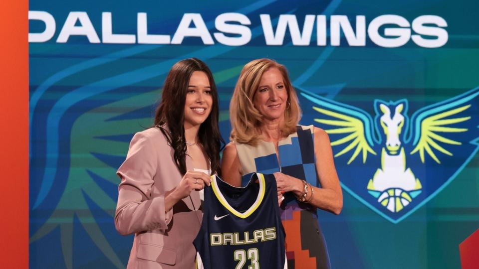 Lou Lopez Senechal poses for a photo with WNBA Commissioner Cathy Engelbert after being drafted fifth overall by the Dallas Wings during WNBA Draft.