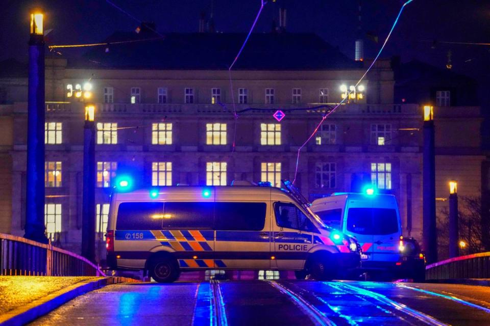 A police van blocks a bridge near the university (AP)