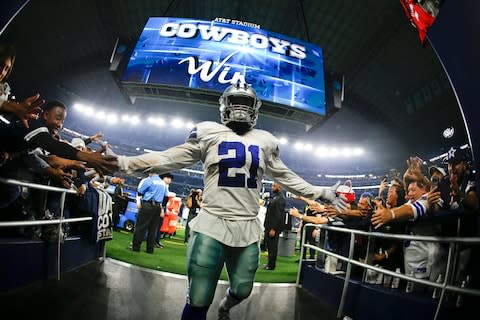 Dallas Cowboys running back Ezekiel Elliott greets fans as he comes off the field following the Cowboys' 31-23 win over the Washington Redskins - Credit: AP Photo/Ron Jenkins