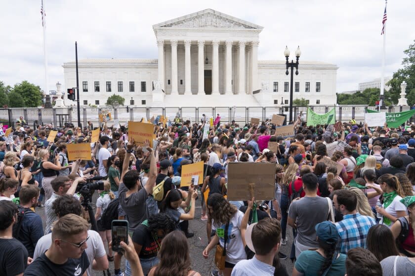 Protesters gather outside the Supreme Court in Washington, Friday, June 24, 2022. The Supreme Court has ended constitutional protections for abortion that had been in place nearly 50 years, a decision by its conservative majority to overturn the court's landmark abortion cases. (AP Photo/Jacquelyn Martin)