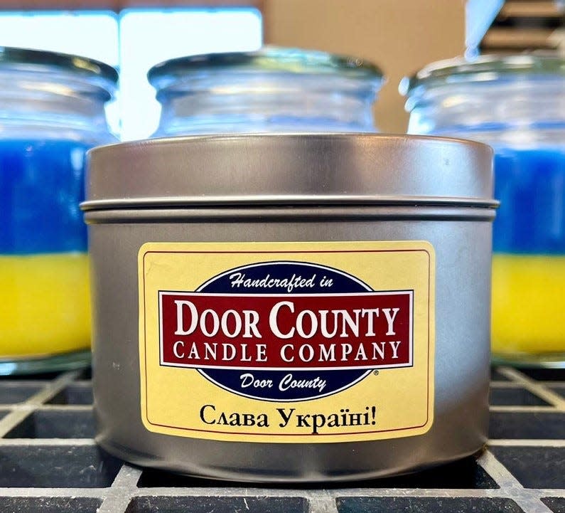 "Glory to Ukraine!" is inscribed on the label of Door County Candle Co.'s Tin Candles for Ukraine, an effort launched in November of 2022 by the Sturgeon Bay candle maker to send thousands of them to Ukraine for use as a light source.