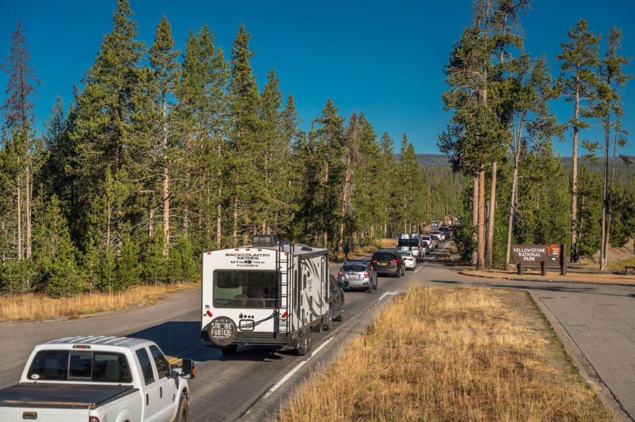 Vehicles line up to enter Yellowstone National Park. The park had its best April ever in 2021, bettering the record it set in 2019 by 40%.