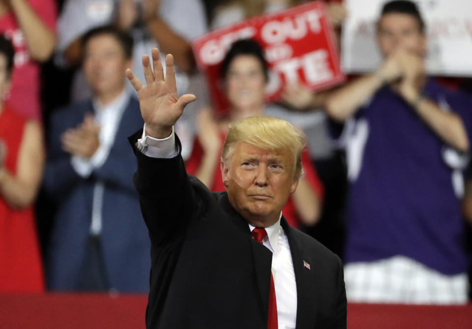 President Donald Trump waves to the audience during a rally Wednesday, Oct. 31, 2018, in FEstero, Fla. (AP Photo/Chris O'Meara)