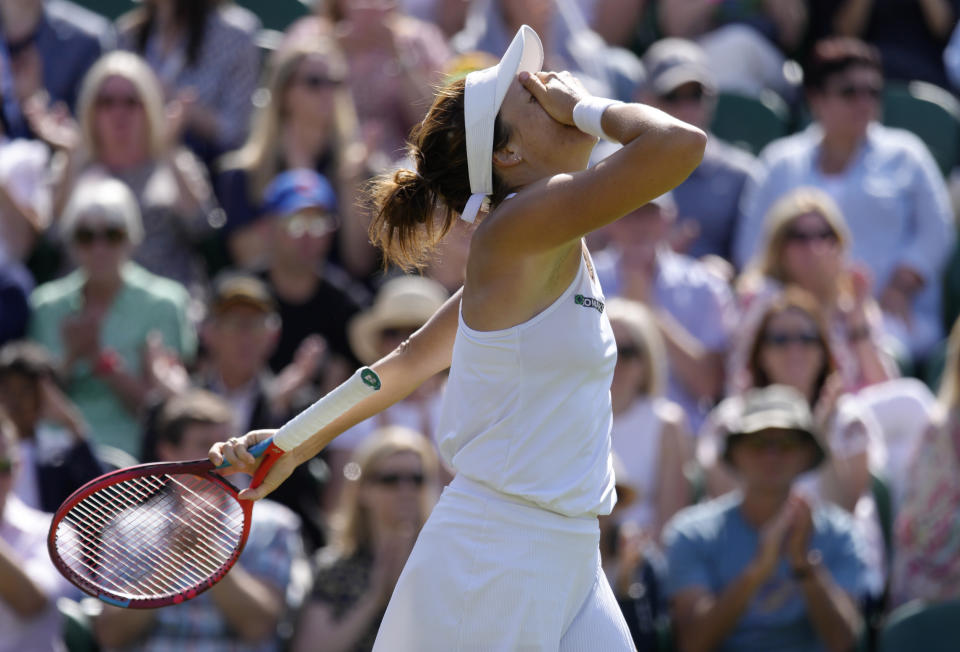 Germany's Tatjana Maria celebrates after match point in her women's third round singles match against Greece's Maria Sakkari on day five of the Wimbledon tennis championships in London, Friday, July 1, 2022. (AP Photo/Kirsty Wigglesworth)