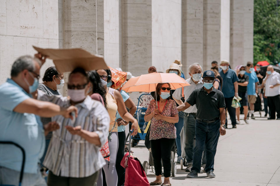 NEW YORK, NY - JULY 29: New Yorkers in need wait in a long line to receive free produce, dry goods, and meat at a Food Bank For New York City distribution event at Lincoln Center on July 29, 2020 in New York City. In addition to unemployment and homelessness, millions of Americans face food insecurity as a result of the economic downturn caused by the coronavirus pandemic. (Photo by Scott Heins/Getty Images)