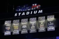 The New England Patriots unveil a sixth banner, right, commemorating the team's Super Bowl 53 victory before an NFL football game against the Pittsburgh Steelers, Sunday, Sept. 8, 2019, in Foxborough, Mass. (AP Photo/Steven Senne)