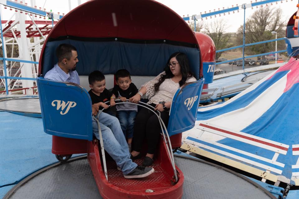 A family enjoys the Tilt-A-Whirl ride at the Wonderland Amusement Park in Amarillo in this April 2023 file photo. The park opens for the season on Saturday, offering a holiday getaway over Easter weekend.