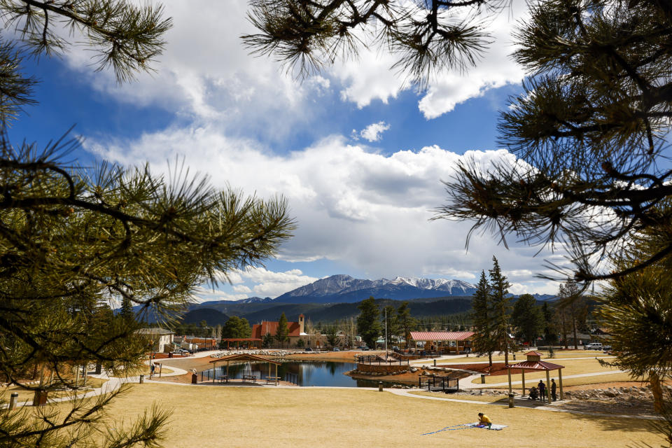 People enjoy a sunny day at Memorial Park on April 12, 2023 in Woodland Park, Colo. (Michael Ciaglo for NBC News)