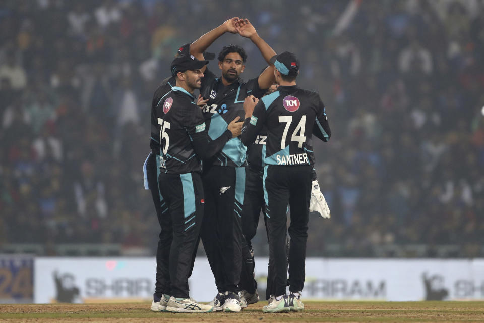 New Zealand's Ish Sodhi, center, celebrates with teammates after the dismissal of India's Rahul Tripathi during the second T20 international cricket match between India and New Zealand in Lucknow, India, Sunday, Jan. 29, 2023. (AP Photo/Surjeet Yadav)