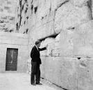 <p>Billy Graham stands by the Wailing Wall in Jerusalem, on March 17, 1960, after an 18,000-mile preaching tour in Africa and the Middle East. (Photo: Leila Wynn/AP) </p>