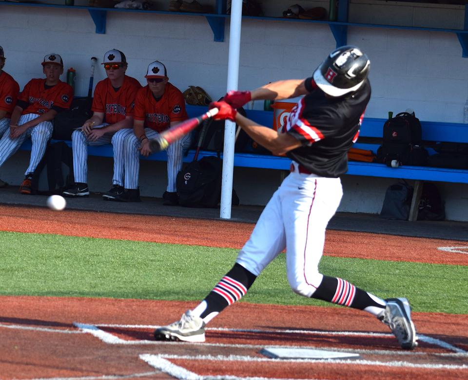 Hiland clean-up hitter Colin Coblentz rips a triple down the right field line in the second inning.